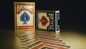 Bicycle playing cards Standard edition with red and blue decks displayed on a wooden surface, showing a neat spread of cards.