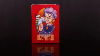 Red old maid card game box with a cartoon elderly woman holding a bird, used in guides on how to play old maid game for family fun.