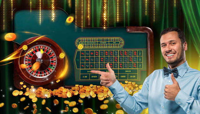 Smiling man beside a roulette table surrounded by golden coins — representing online casino excitement and free spin bonus Casinomentor offers.
