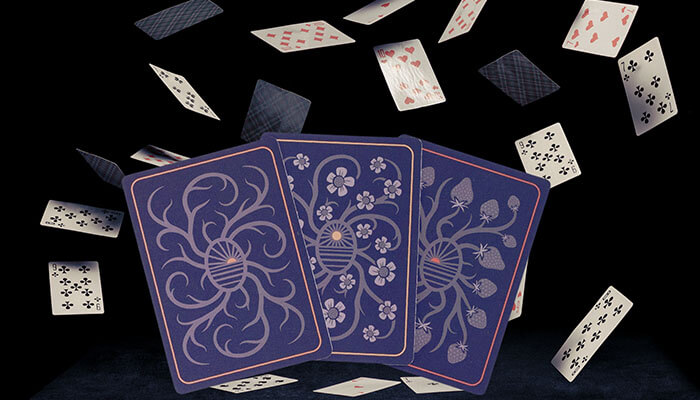 Colorful deck of playing cards scattered in the air — creative concept representing funny card games for Gen Z and party entertainment.