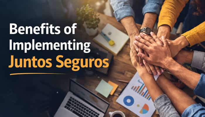 Benefits of Implementing Juntos Seguros - Live Casino Magic - Live CasinoMagic Juntos Seguros concept showing a diverse team collaborating around a table, reviewing charts and documents while stacking hands together to represent teamwork, trust, and shared benefits in a professional setting.