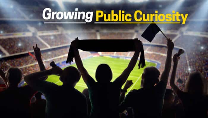 Growing Public Curiosity - Live Casino Magic - Live CasinoMagic Kathleen Lynch Celtics public curiosity represented through passionate basketball fans in a stadium, highlighting growing interest in team leadership, franchise connections, and professional basketball discussions.