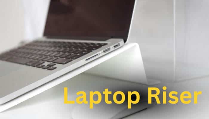Laptop Riser - Live Casino Magic - Live CasinoMagic Modern aluminum laptop stand setup showing what is a riser desk accessory for ergonomic workspace improvement, better screen height, reduced neck strain, and healthier posture.