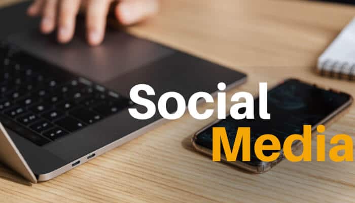 Social Media - LIve Casino Magic - Live CasinoMagic Contact PlayBattleSquare through social media support channels, shown with a laptop and smartphone on a desk for fast gaming community communication.