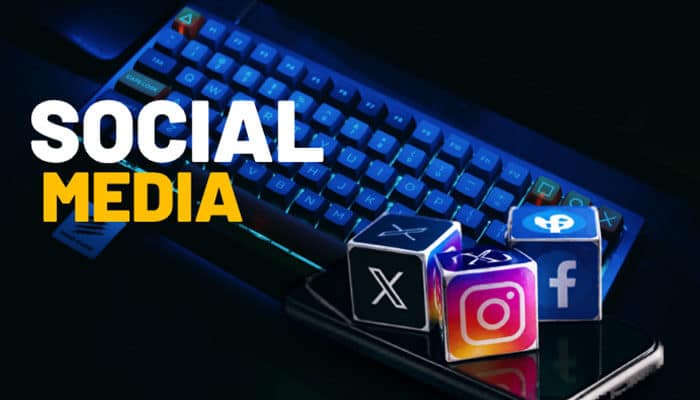 Social Media - Live Casino Magic - Live CasinoMagic Contact Address ImagineerGames social media communication concept featuring Instagram, Facebook, and X platform icons on a smartphone beside a gaming keyboard, representing official social media support channels, community engagement, updates, and customer interaction methods for ImagineerGames players in 2026.