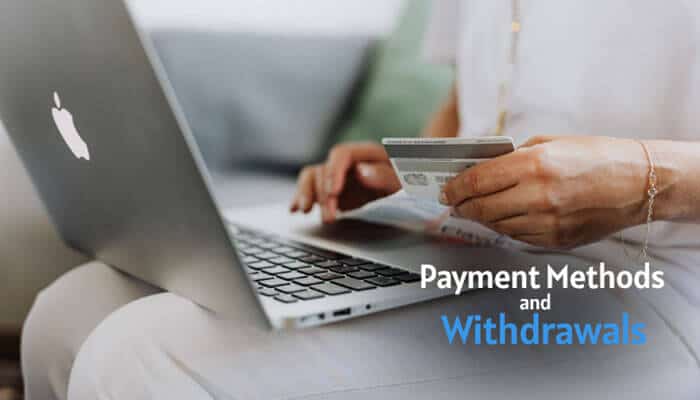 Payment Methods and Withdrawals - Live Casino Magic - Live CasinoMagic FanDuel Casino Bonus payment methods and withdrawals image showing a user holding a bank card while using a laptop for online casino deposits and cash-out transactions.