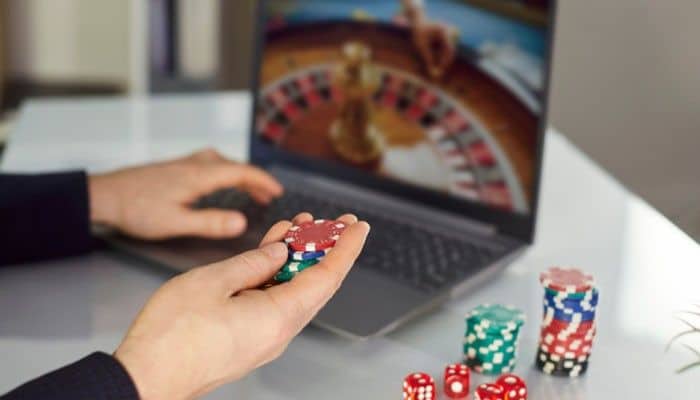 RealPrize Casino Welcome Bonus - Live Casino Magic - Live CasinoMagic RealPrize Casino welcome bonus experience showing online casino gameplay, virtual chips, laptop gaming interface, and promotional rewards